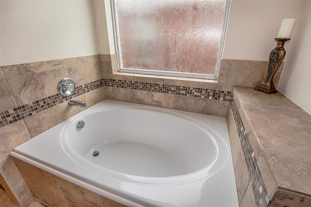 The large garden tub is the perfect place to relax after a long day.