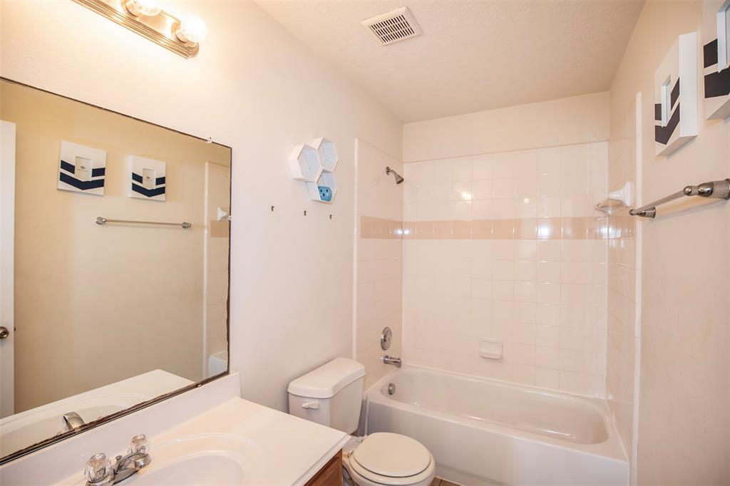 The guest bathroom sits between the secondary bedrooms.