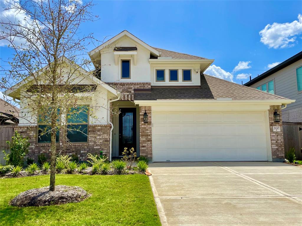 Welcome home to 26307 Rising Light Lane in the Candela Community.
