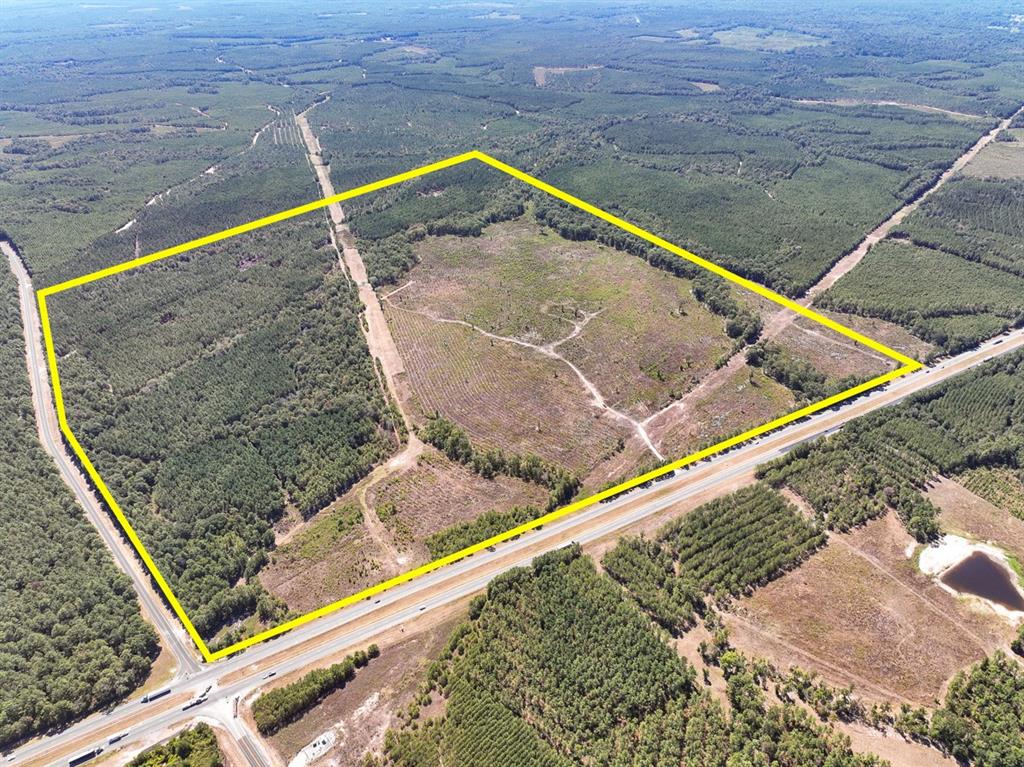 CORNER tract. US 59 and FM 1987 Frontage for this 1st time open market offering. Forested timberland over rolling sandy to loamy topography. Big recreation and high fence candidate. Several lake sites with creek drain breaks towards Lower Sulphur Creek on eastern boundary. Easy access for future development potential.