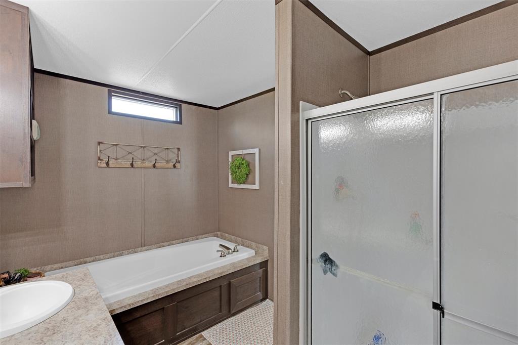 Large soaking tub and separate shower.