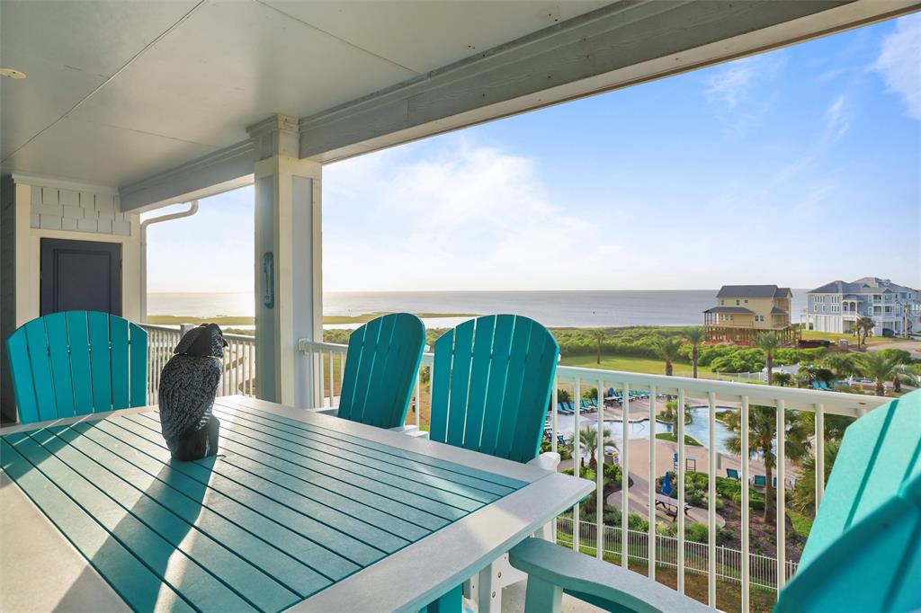 What a remarkable view from this top floor corner three bedroom overlooking the Sunset pool and Galveston bay