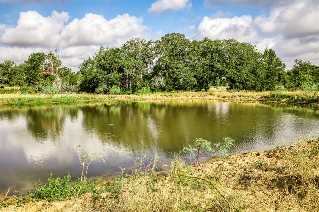 53.956 +/- Acres in the heart of central Texas with minerals negotiable!!!! Features include a spacious 4 bed/3 bath house, 40 X 80 insulated shop, two septic’s, two water wells and two full RV hook ups. Multiple barns for livestock or equipment. Two ponds stocked with bass, one said to be spring-fed. Deer and hogs frequent the property providing some great opportunity for hunting. Option to build out the shop into another living quarters with its own water well and septic in place. Ag Exempt being used for both cattle and hay production. Located on a county road but in close distance to HWY 36. Enjoy the quiet country life being close to town. 6.4 miles to Caldwell, 28 miles to Brenham, 32 miles to College Station, 85 miles to Austin, 102 miles to Houston.