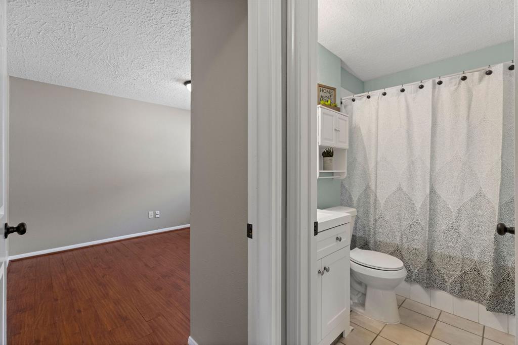 Guest bathroom is in the middle of secondary bedrooms