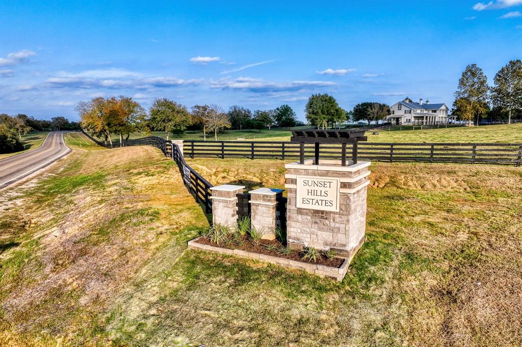 Entry with sprawling ranches in the background