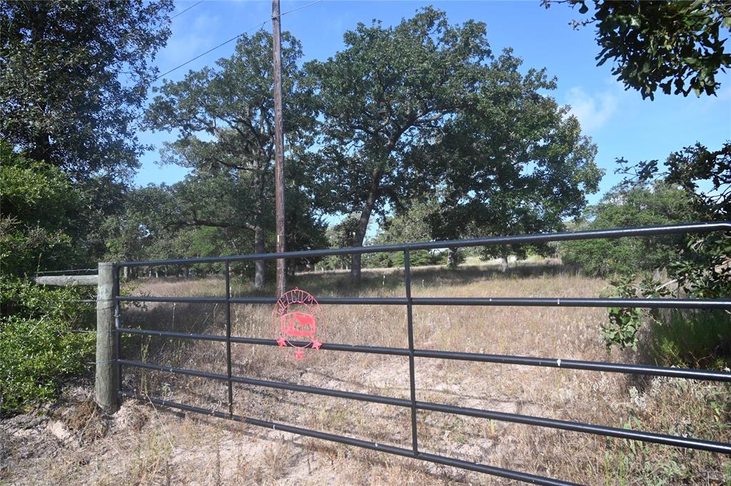 This is the gate fronting Walnut Dr which is county maintained county road.  This track is +/- 2 acres and the sellers are willing to sell it separately.