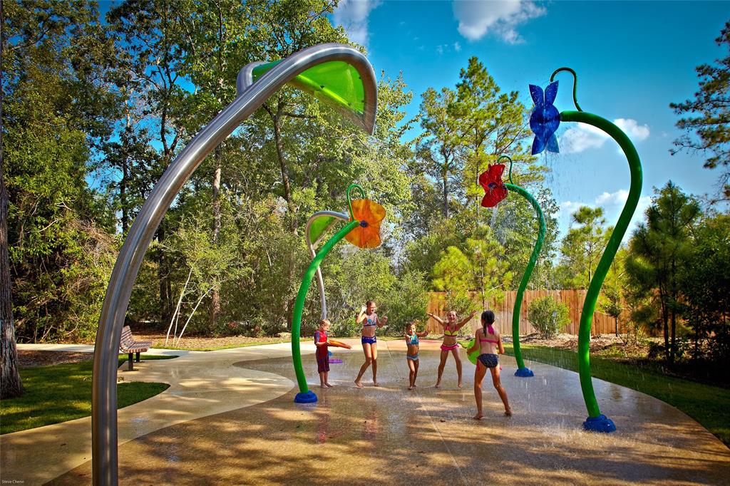 A winding pathway through the trees connects Forest Island\'s tennis courts, basketball court and swimming complex with the 3-acre Lily Pad Spray Park, giving Woodforest residents nearly 20 acres of fun!