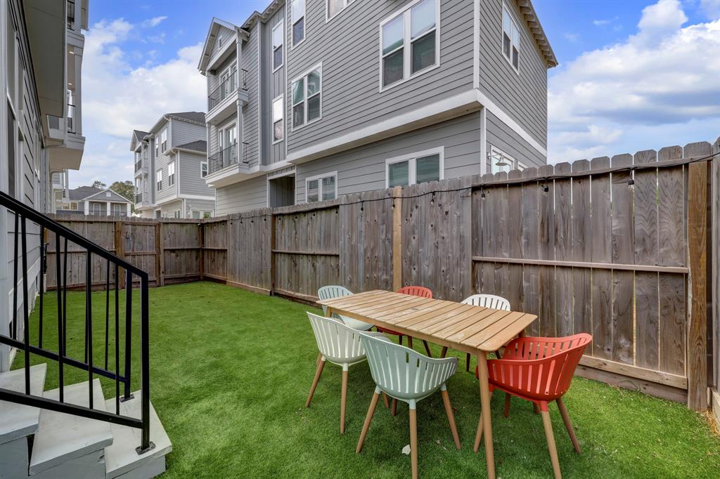 The backyard features low maintenance turf!