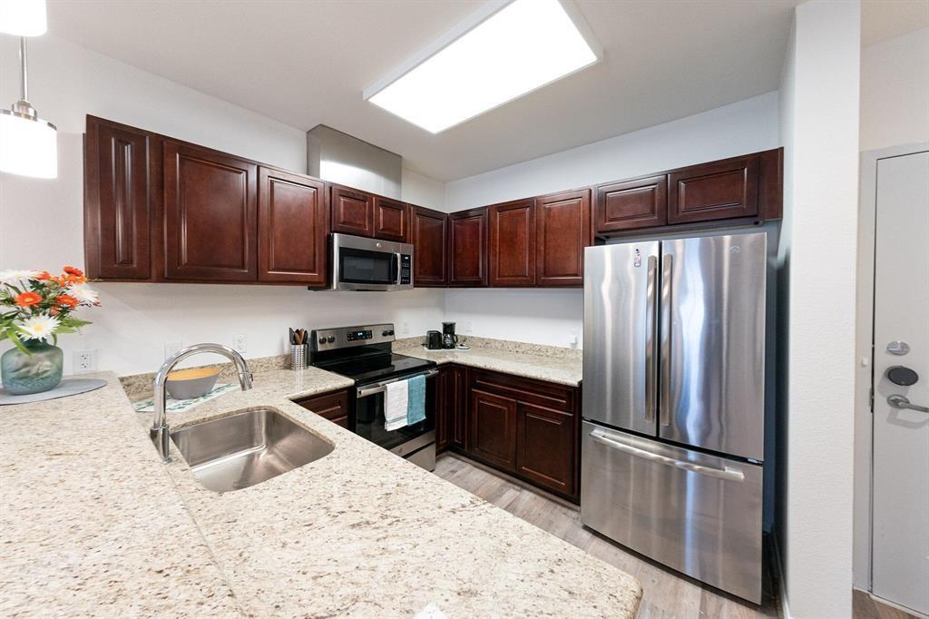 The upgraded cabinets with soft-close drawers, granite counter tops and breakfast bar