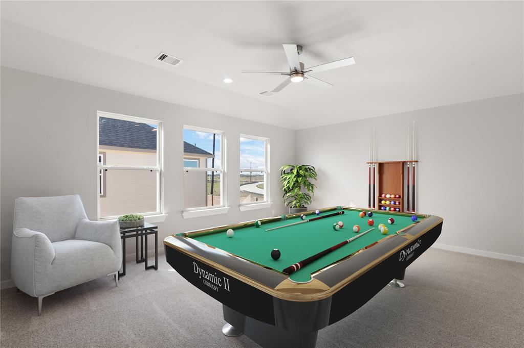 Come upstairs and enjoy a day of leisure in this fabulous game room/media room!!!  This is the perfect hangout spot or adult game room, this space features plush carpet, high vaulted ceiling, recessed lighting, and custom paint.
