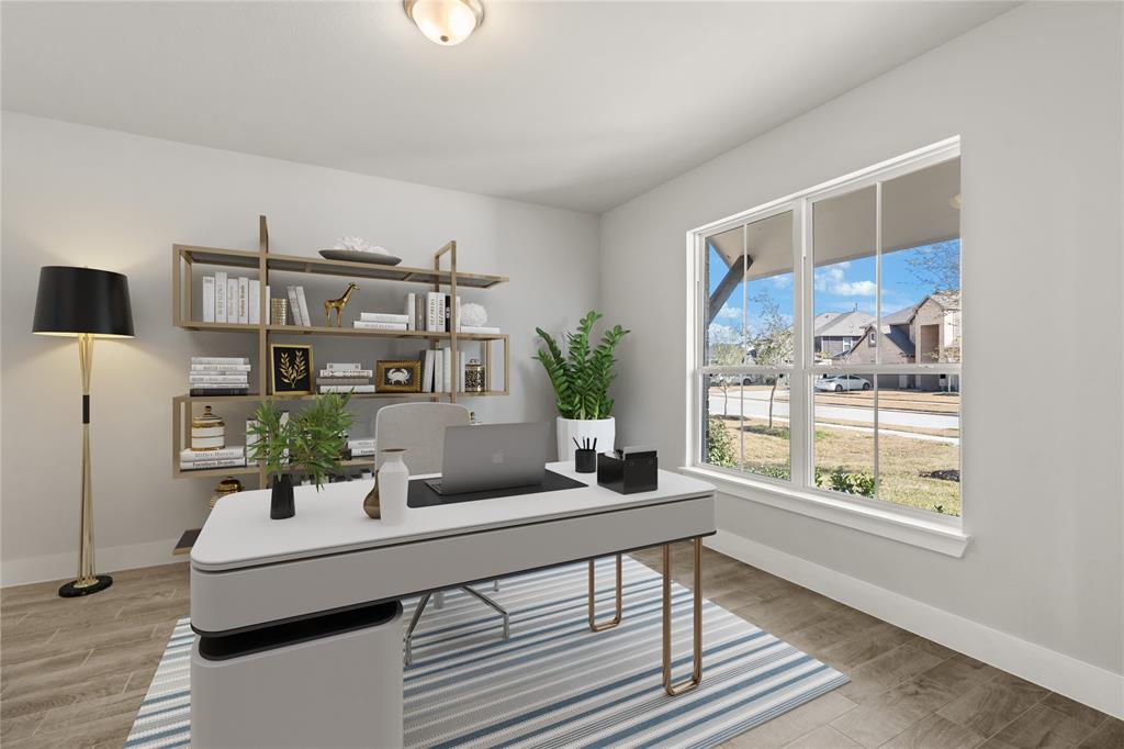 Nestled away quietly in the front of the home is the handsome and grand home office! Featuring custom paint, large tile flooring, and large window with privacy blinds!