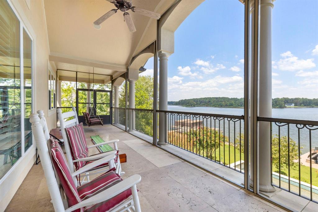 This home has three screened in porches to take in the lakefront views.