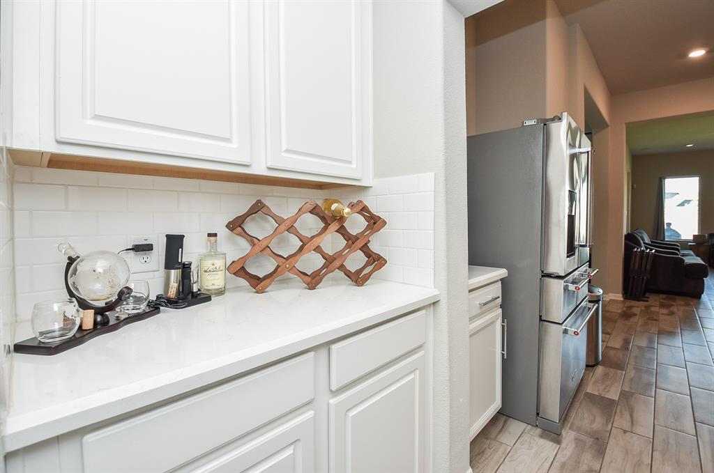 This transitional space can be used as a butler pantry space, sits right off the kitchen for easy access