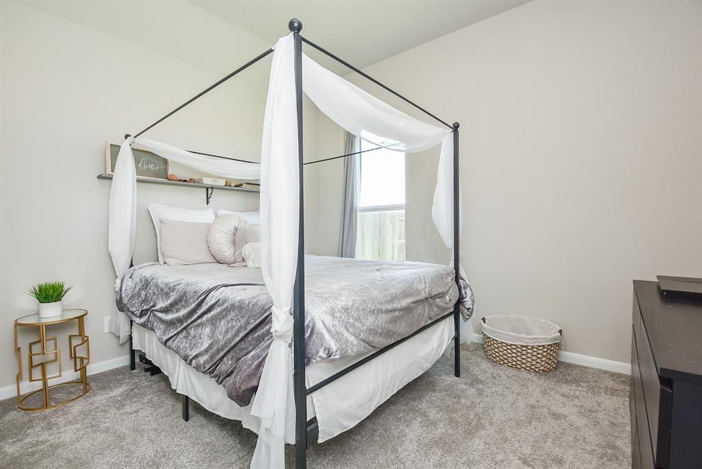 Private bedroom with own bath adjacent located towards back of home in its own corner space