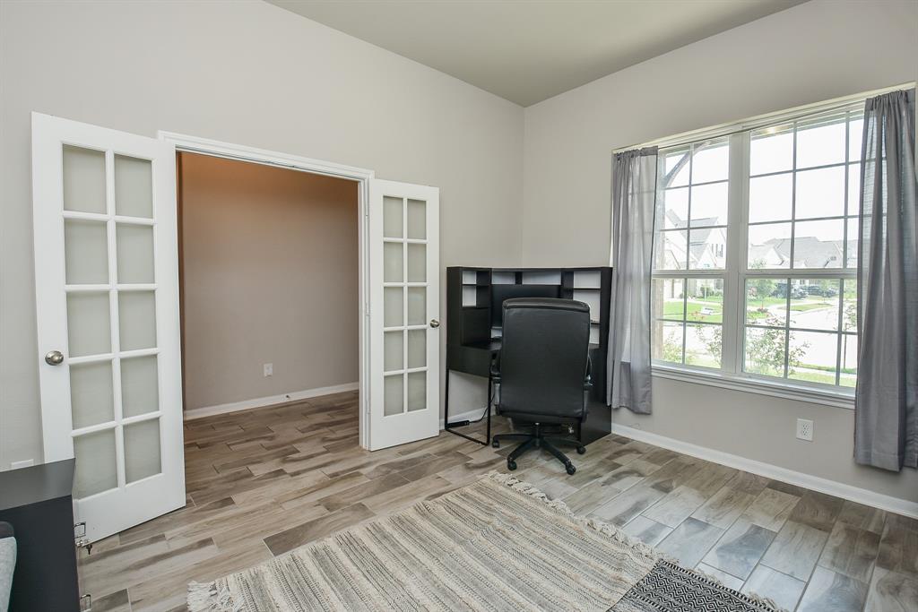 Study/Home Office with french privacy doors sits off the front entry of this home