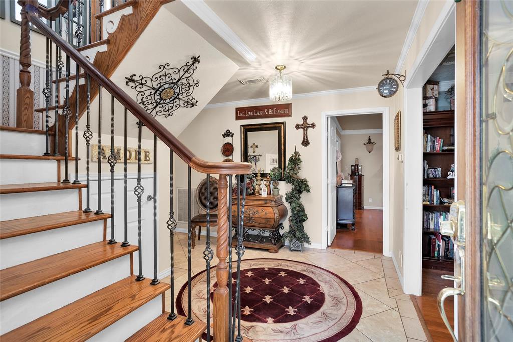 Beautiful foyer with the study to the right.  2 bedrooms are downstairs and 2 bedrooms are upstairs.