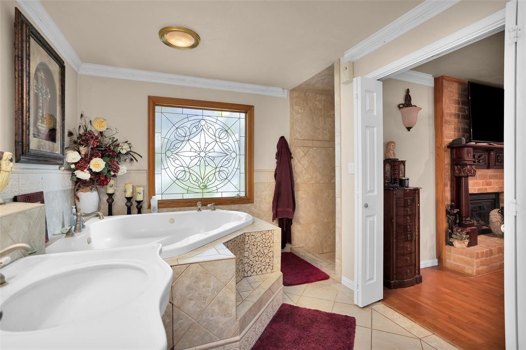 Spacious Master Bath with large step in shower and large soaking tub.
