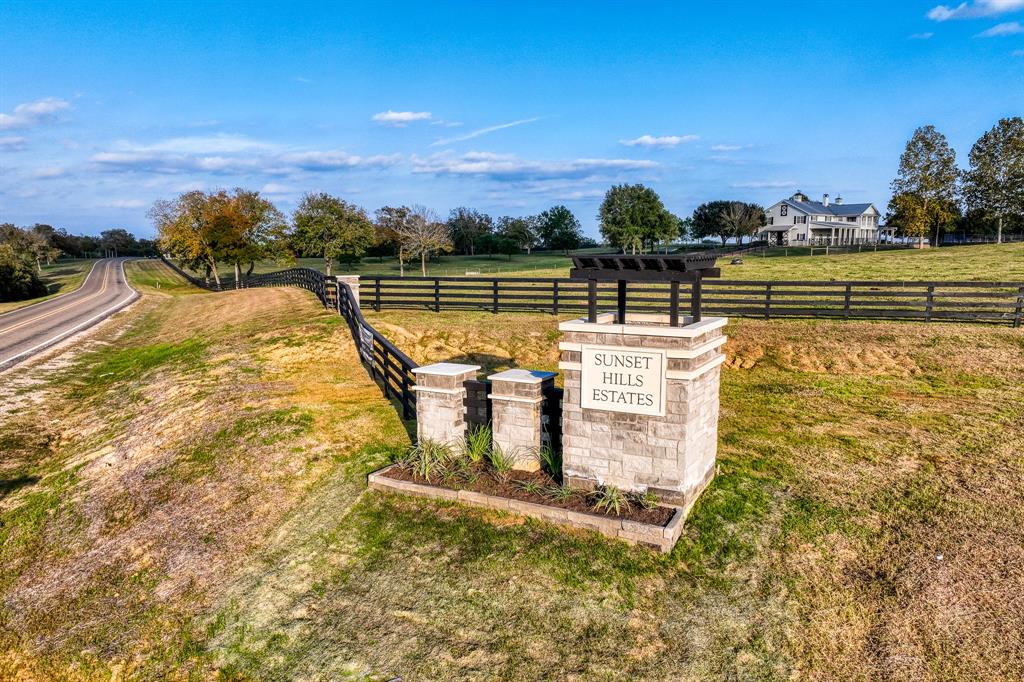 Entry with sprawling ranches in the background