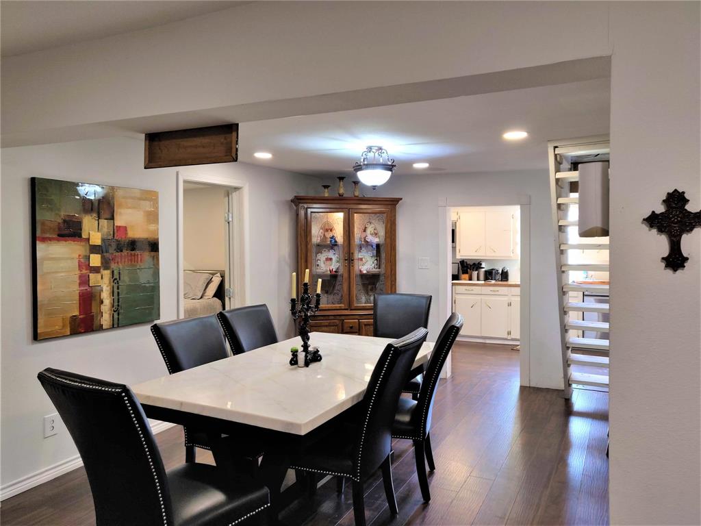 What a great dining room with the kitchen beyond and a staircase leading to the attic/loft.