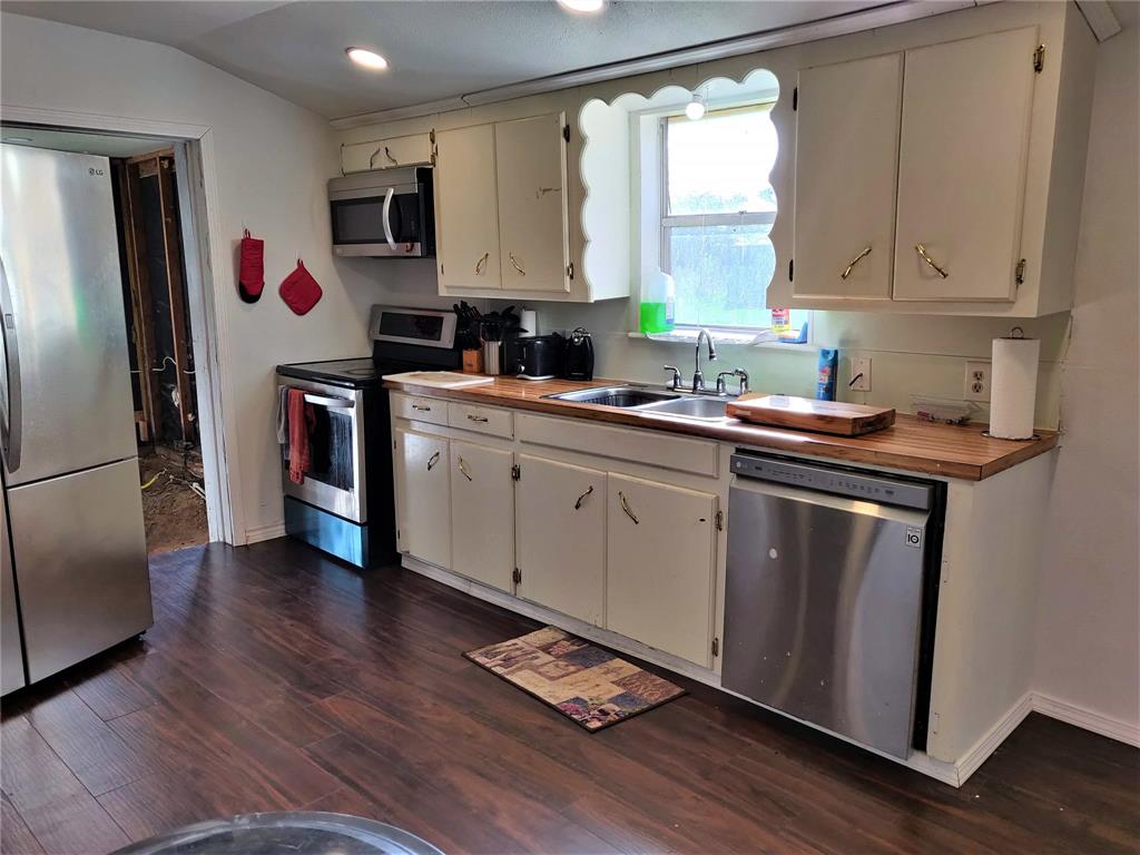 The kitchen is roomy and and is centrally located.