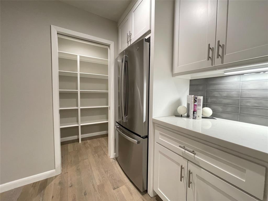 The designer kitchen has a walk-in pantry (a rare find in the Hyde Park Condos development!)