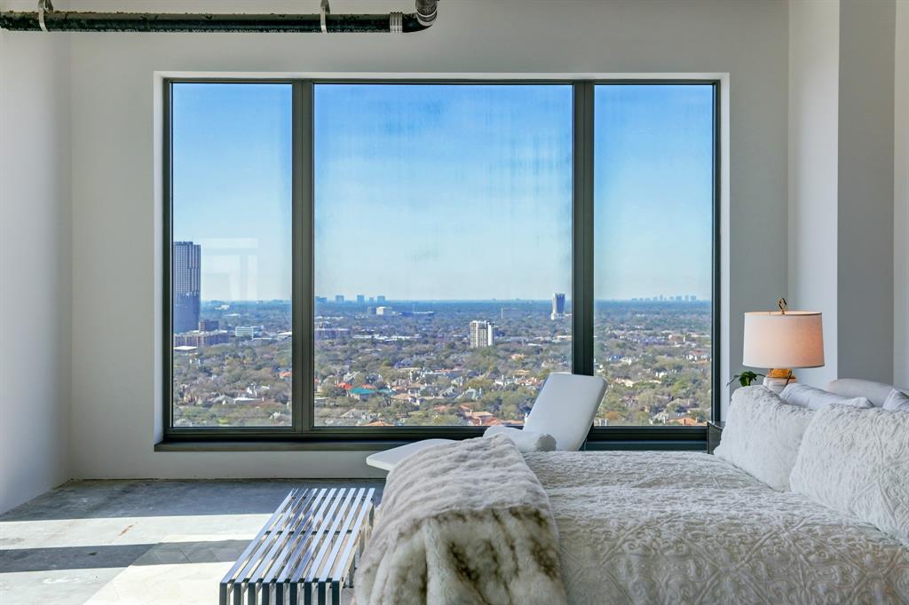 Large windows frame the Houston skyline.
