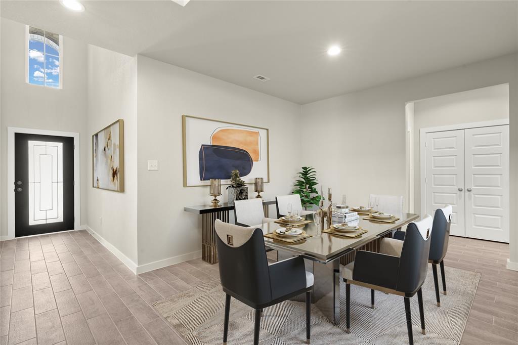 Make memories gathered around the table with your family and friends! This dining room features high ceilings, custom paint and gorgeous flooring.