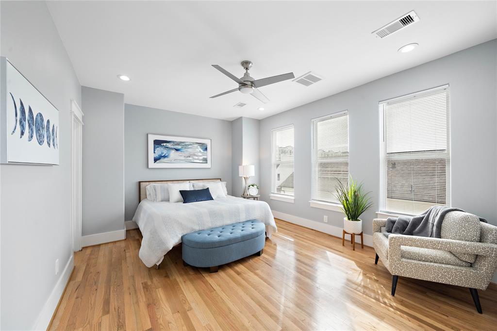 A true retreat, the primary bedroom features gorgeous hardwood floors, a spa-like bath, and separate closets for added convenience. Large double-pane windows flood the bedroom with lots of natural light and frame delightful views of the neighborhood.