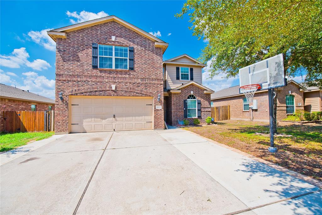 30923 E Lost Creek Boulevard Magnolia, Texas Beautiful home with lake view access. Home features 5 bedrooms, 2 1/2 bathrooms and a large game room. Hardwood/tile throughout the first floor. Large covered patio with a view of the lake and large backyard for outdoor activities.