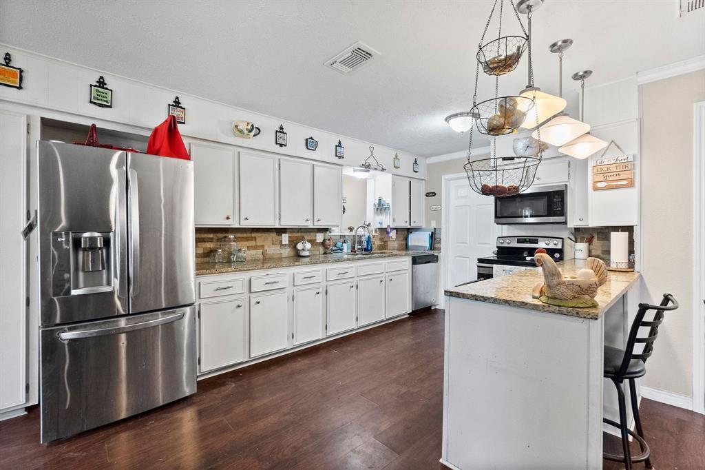 The kitchen has granite counter tops