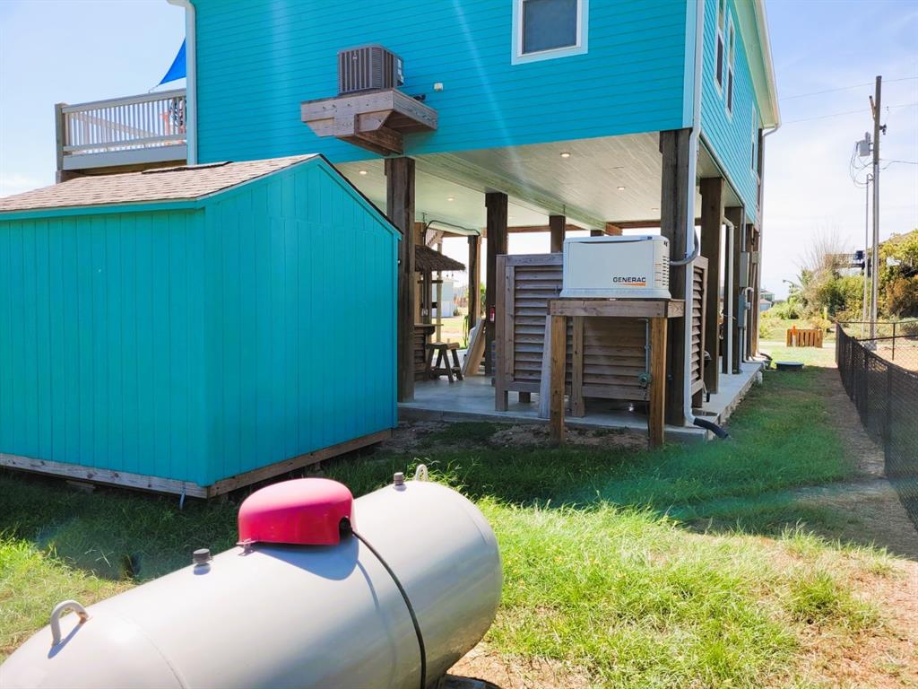 Whole-home generator and propane tank.