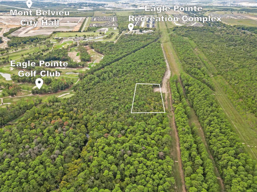Approximately 12 acres if purchased with the neighboring property in the heart of a growing, developing Mont Belvieu community.  This property is located right behind the Eagle Point Golf course.  Great opportunity to get in on the development side of real estate.  All developers and builders this could be a great opportunity!