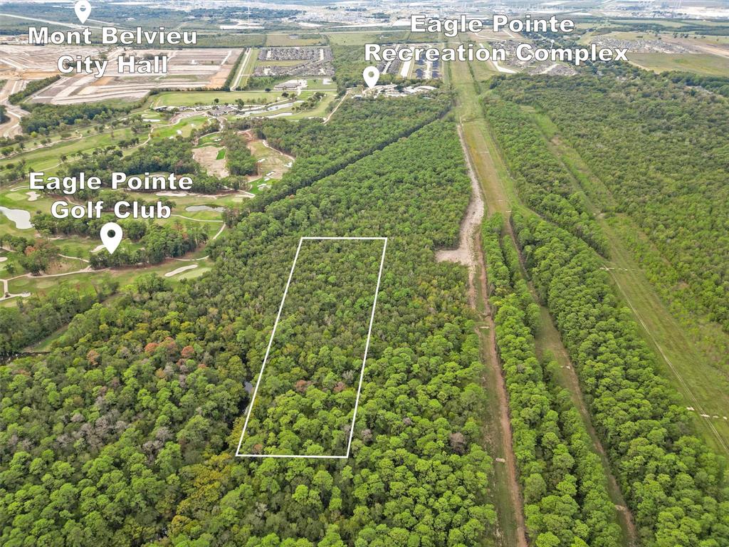 Approximately 12 acres if purchased with the neighboring property in the heart of a growing, developing Mont Belvieu community.  This property is located right behind the Eagle Point Golf course.  Great opportunity to get in on the development side of real estate.  All developers and builders this could be a great opportunity!