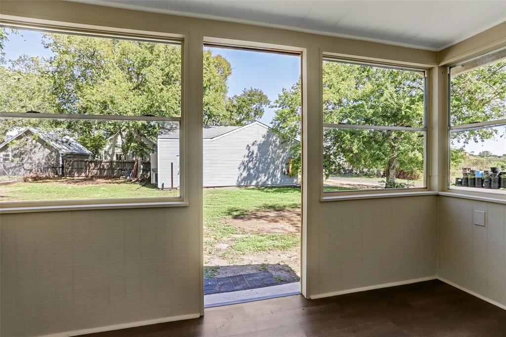 Sun room space could be used as an artist nook, plants, quiet reading area or storage.