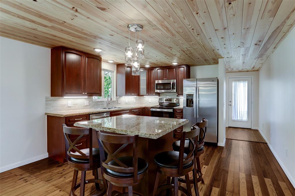 Granite counters and under counter lighting are only a few of the decorator touches.