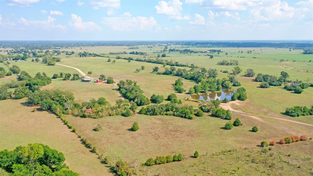 This picturesque 192-acre property in Madison County offers the perfect blend of modern convenience and rural living. With its close proximity to amenities and easy access to I-45, it's an ideal homesite and ranch land. The property features two ponds, one at the front and a larger one at the back, enhancing the landscape and offering recreational potential. For those interested in livestock, there are cattle pens at the front. The 4-bedroom, 2-bath house on the property provides a spacious and comfortable living space, complete with a large, inviting back porch. This land is incredibly versatile, catering to activities such as hunting, horse-related pursuits, and more. This opportunity is perfect for those looking to experience the best of both worlds a harmonious blend of rural living and modern convenience. Call The Wells Team to schedule a showing today!