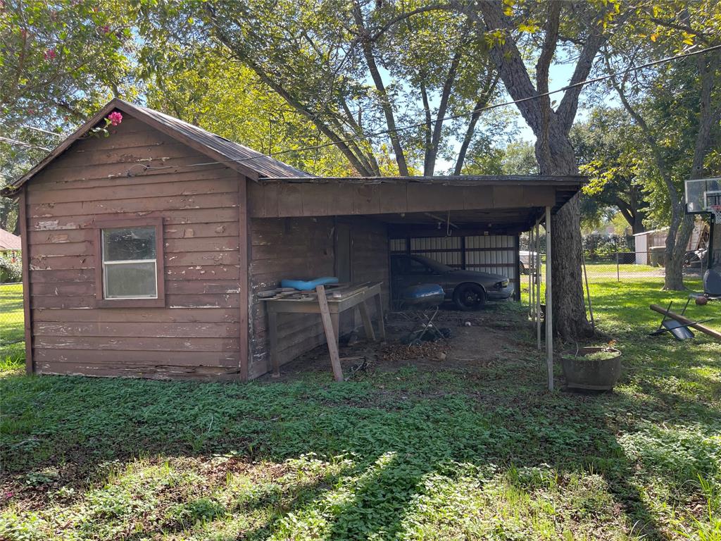 Storage Shed, Covered work/storage area, and another Two Carports