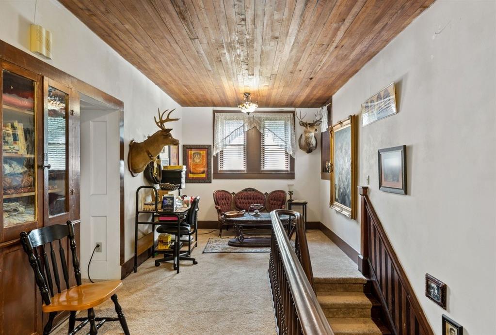 The upstairs sitting area shows the new carpet with thick plush pad.