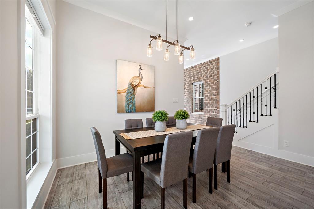 A spot made for gatherings, the dining area by the windows can easily seat a group of eight and more while leaving plenty of space to move around.