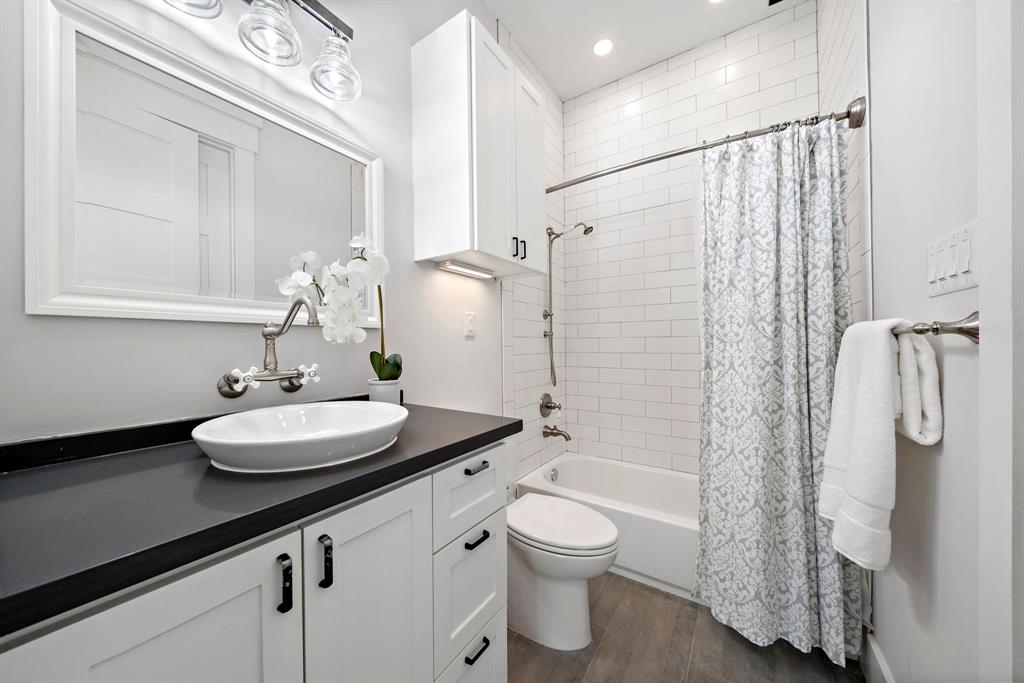 The garage apartment's ensuite bath comes complete with an alcove tub and shower, ample cabinet space, plus a quartz vanity area.