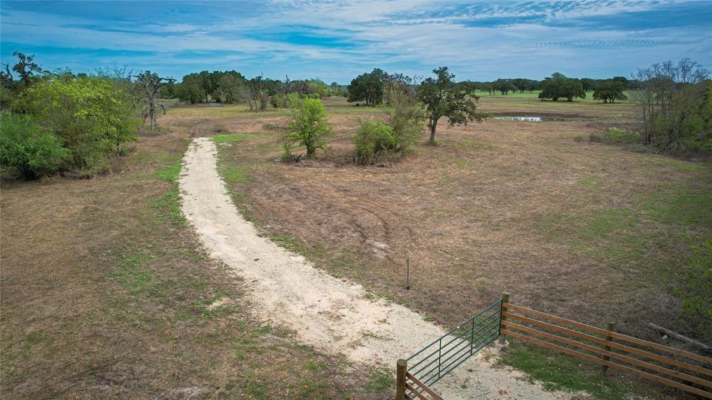 Nestled in the heart of Grimes County just outside of Iola, TX sits this +/-24.5 acre parcel of land. The tract offers an unparalleled opportunity to create your dream rural oasis. The property consists of mostly open pasture land with scattered trees along with 3 ponds. The jewel of this tract is the northern tank that is stocked with Large mouth Bass. The property also offers perimeter fencing, approximately 840 ft. of County Road frontage, power along the road, and a 1.5 water line located on the south side of the road. Located only 30 minutes from Bryan/College Station this tract of land offers the peace and quiet of the country within a short drive of city amenities. This property offers exceptional investment potential along with a great opportunity for recreational/agricultural use, building a dream home, or getaway place. With abundant space and natural beauty, this property is a canvas waiting for your vision.