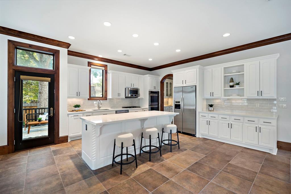 Extend your entertainment spaces to the outdoors, with easy access from the kitchen and breakfast areas to the wooden deck.