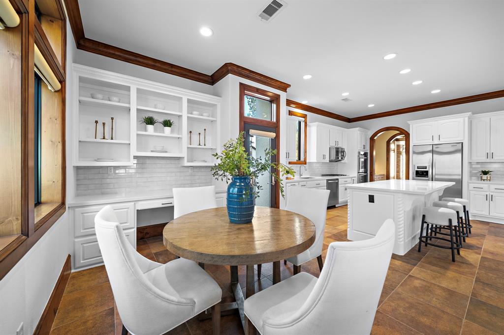 Easily accommodate a large group of guests with a spacious breakfast area and kitchen island, offering plenty of space for extra seating.