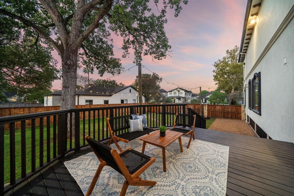 Accessible from the kitchen and breakfast nook, the private deck features fresh paint, wood flooring, and ample space for outdoor lounging.