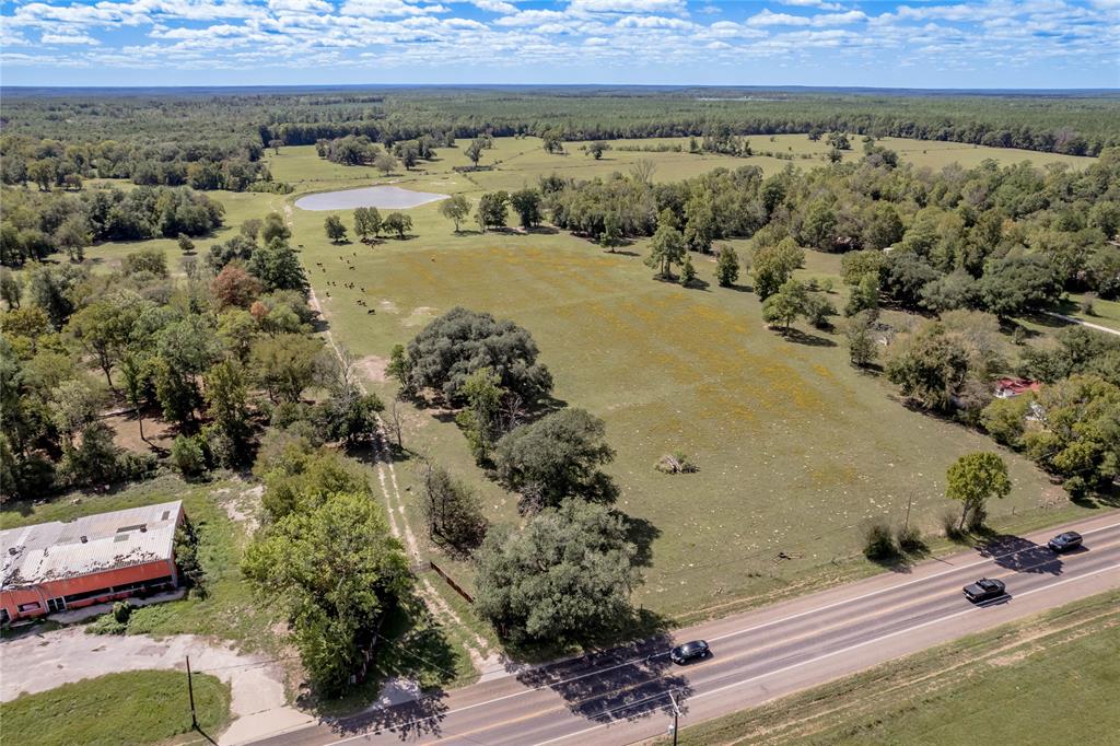This property is located within the city limits of Groveton with all utilities available.  The property is presently being use for cattle grazing and cow/calf production.  The property is completely fenced, has hwy.  287 frontage, livestock pens and has a 1-d-1 Agricultural Use Appraisal for tax purposes.  The property has many options for use.  The property contains several tax ID#s: 16488, 19444, 19434, 19436, 52051, 19439,19454, 53334, 36127.