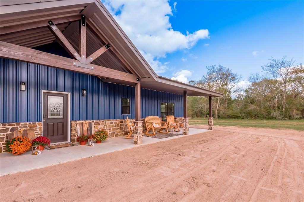 Welcome home to 1560 Lonesome Dove Dr in Groveton, TX. This is country living at its finest! No detail was spared in the construction of this Brand New home that sits on 40 peaceful acres. From the moment you step onto the full length front porch you will feel right at home. Inside the door you will find wood-like tile floors through out, high ceilings and luxury galore. There are 3 bedrooms, including a private primary bedroom that boasts 2 walk-in closets and en-suite primary bath. The two secondary bedrooms and one bathroom are located on the opposite side of the home along with the laundry room. In the middle you will find an open concept living room, dining room and kitchen which has stainless steel appliances, a breakfast bar and a view of the great outdoors. One side of this property borders the National Forest giving you to upmost privacy. This is a must see, so make your appointment today!