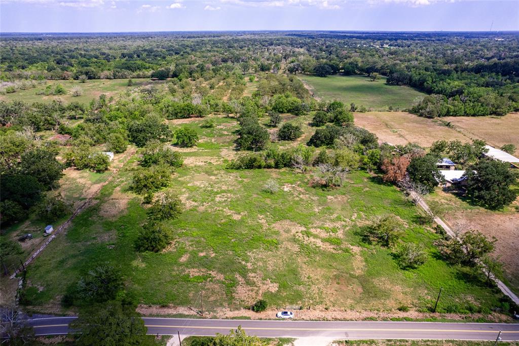 This beautiful Wild Peach Village property is 52.5 acres and sits in-between West Columbia and Brazoria. This sprawling land has unlimited potential. Once sectioned as an orchard, now has plenty of vast open space with some tree coverage and pond on the north side. Make this green, oasis into your dream property.