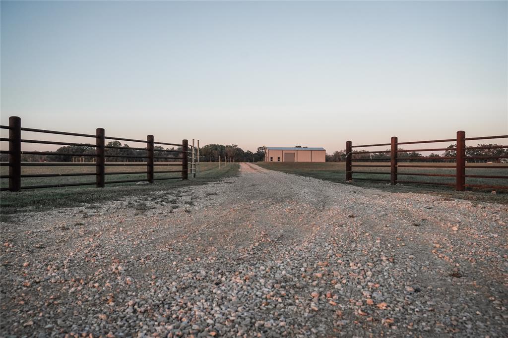This 28-acre home site in Navarro ISD at 851 Branch Rd is located inside the highly sought-after, gated ranch community of Bluestem Reserve. As one of the highest elevation tracts in Bluestem, you'll enjoy a picturesque hillside view of the rolling terrain & native brush of Guadalupe County, minutes from the historic towns of Gruene and Geronimo, Texas! A 4000 sqft Guada-Coma metallic building on-slab with 2000 sqft equipment awning along one side was built in 2023. A 2000 sq ft, two-story apartment has been started and ready for your final design & completion! The bldg is equipped with 600amp service from GVEC and is completely perimeter fenced, Ag Exempt, and ready for your horses and cattle! A custom pipe entrance is in place and a residential water meter is installed from Crystal Clear SUD. At only $950 annually, the Bluestem Reserve HOA holds all the residences to the highest of standards and maintains the main gated entrance and roads throughout the subdivision! Call us now!