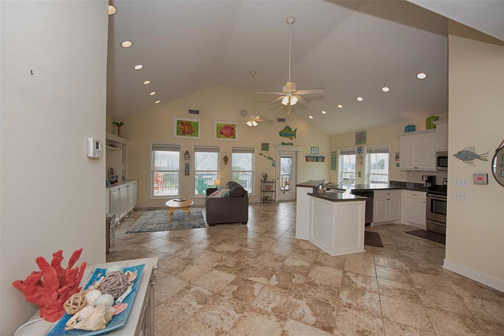 Another view of the tremendous space of the family room with easy access to the kitchen as you approach the bedrooms.