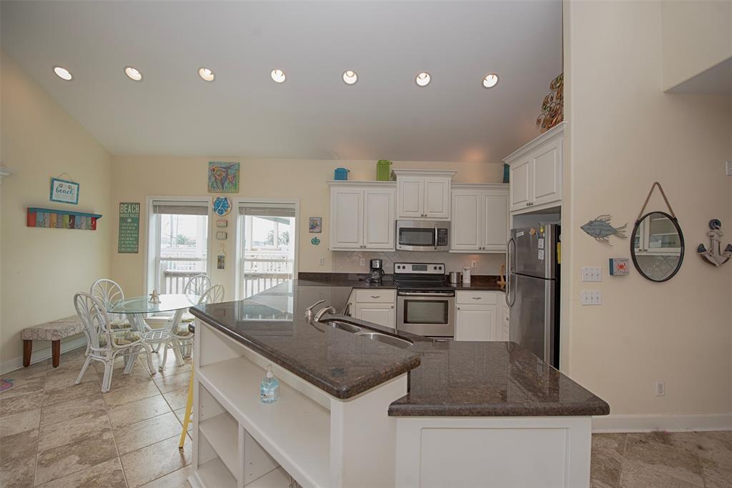 Entry to the kitchen with wrap around breakfast bar.